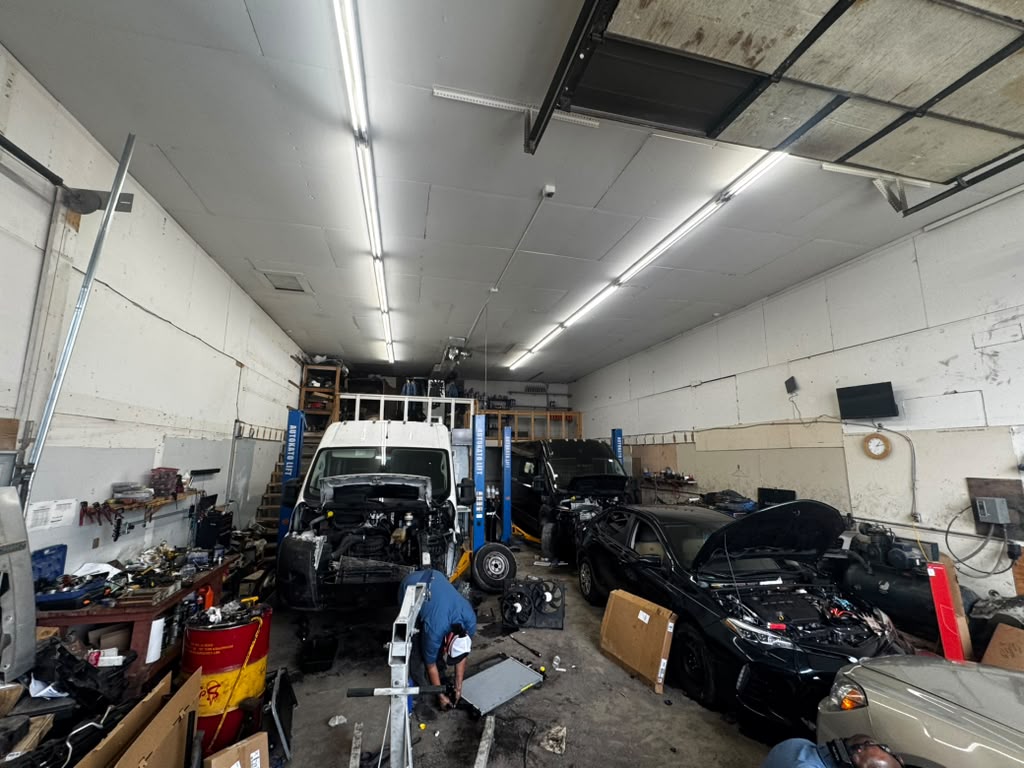 Wide view of the Eaglesoar service floor with vehicles on lifts
