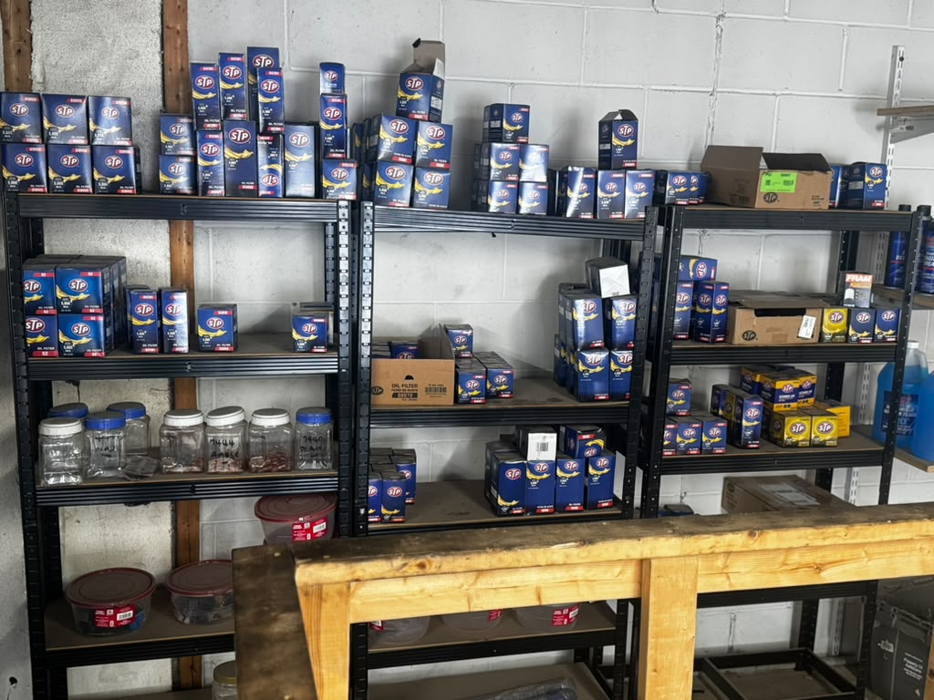 Shelves fully stocked with oil filters and maintenance parts